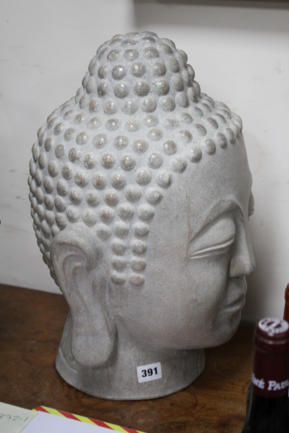 A Far Eastern ceramic Buddha head, height 44cm